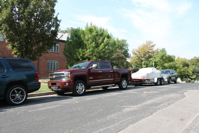 Illustration for article titled Towing A Race Car With A Small House: The Silverado 2500 High Country